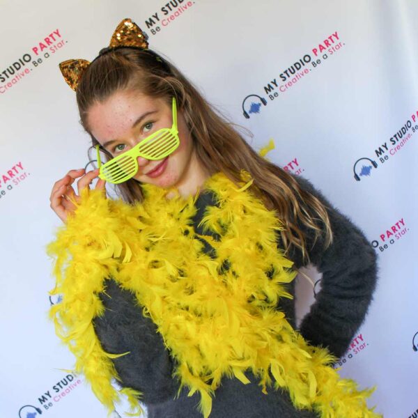 Girl with yellow accessories on the red carpet at My Studio Party superstar birthday party package