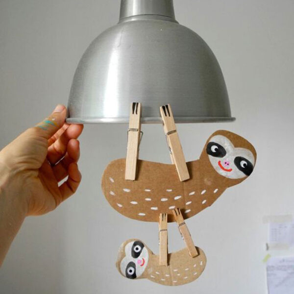 sloth paper craft hanging from light ficture