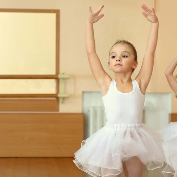 young ballet dancer with hands up